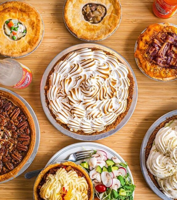 A table with several pies seen from above